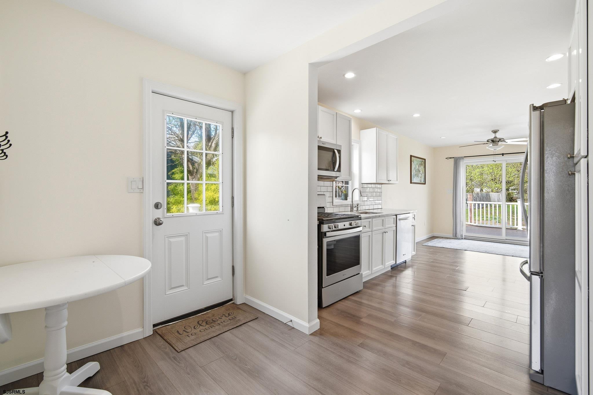 395 1st Street Northfield, NJ 08225 - Photo 11 of 54 a kitchen with a sink and a stove top oven