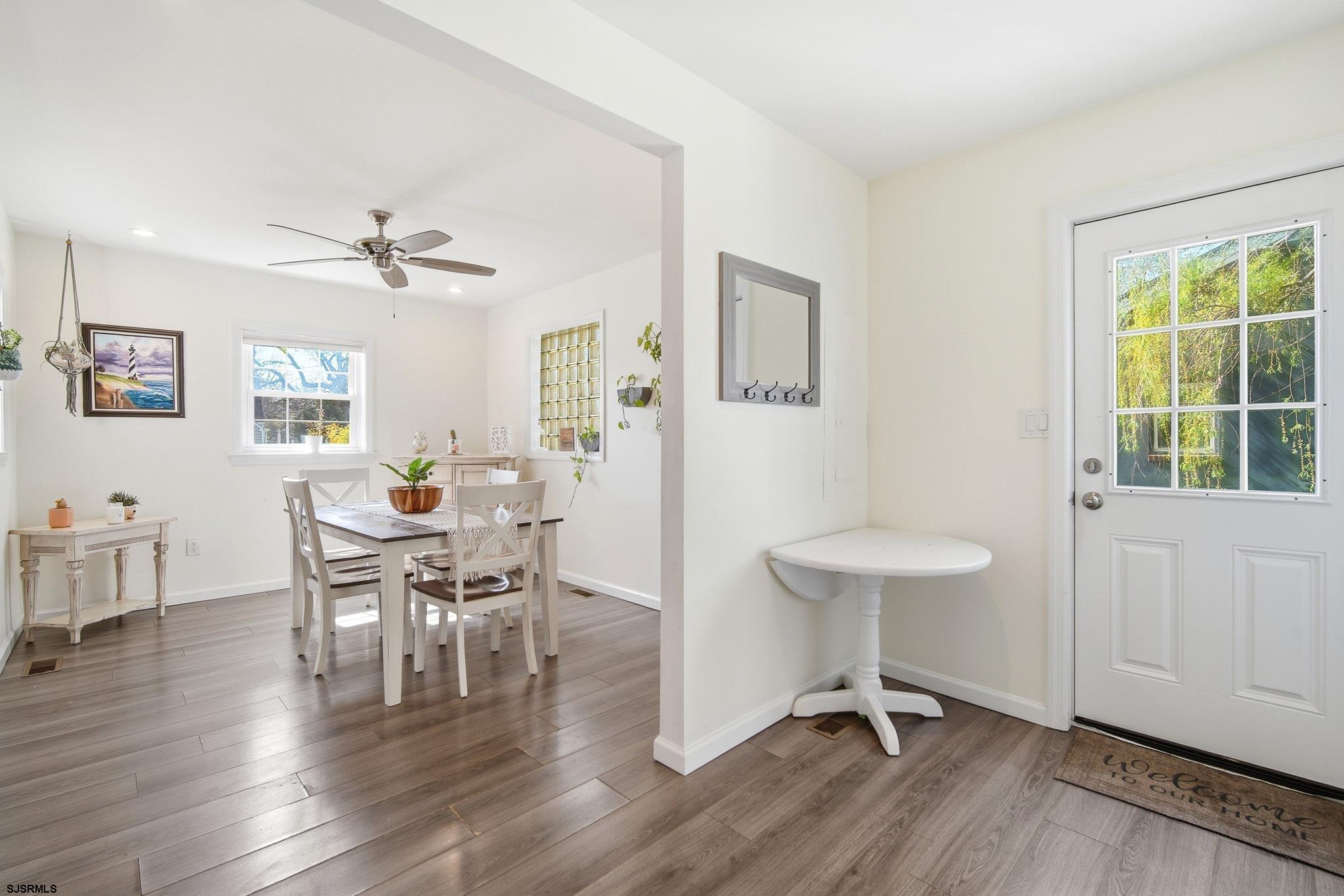 395 1st Street Northfield, NJ 08225 - Photo 17 of 54 a view of a dining room with furniture and a window