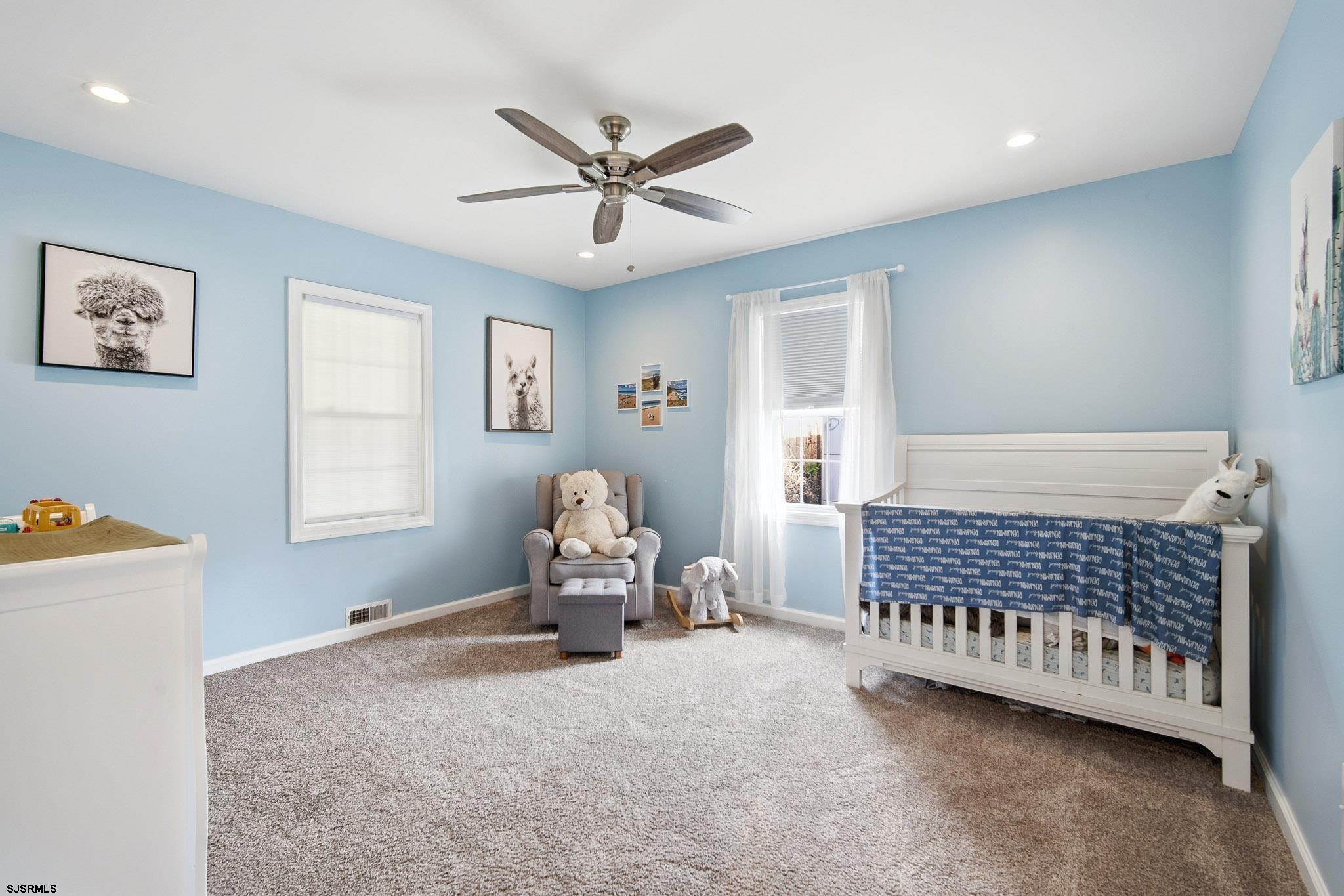 395 1st Street Northfield, NJ 08225 - Photo 20 of 54 a bedroom with a bed and a window