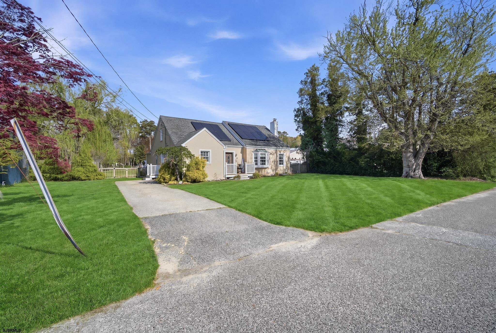 395 1st Street Northfield, NJ 08225 - Photo 2 of 54 a view of a house with a big yard
