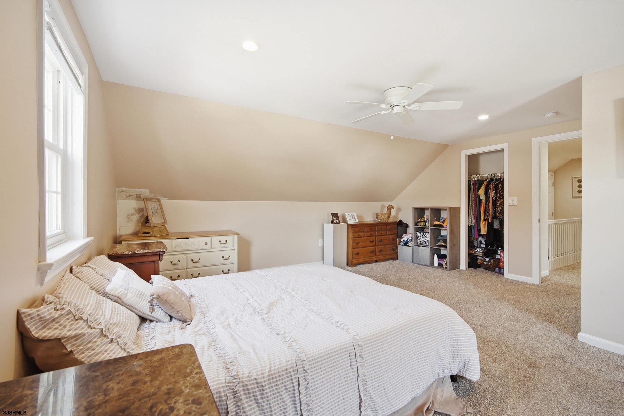 395 1st Street Northfield, NJ 08225 - Photo 27 of 54 a bedroom with a large bed and a large window
