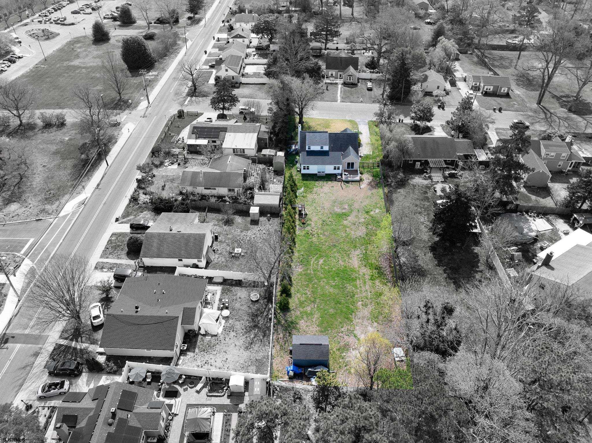 395 1st Street Northfield, NJ 08225 - Photo 39 of 54 an aerial view of residential houses with outdoor space