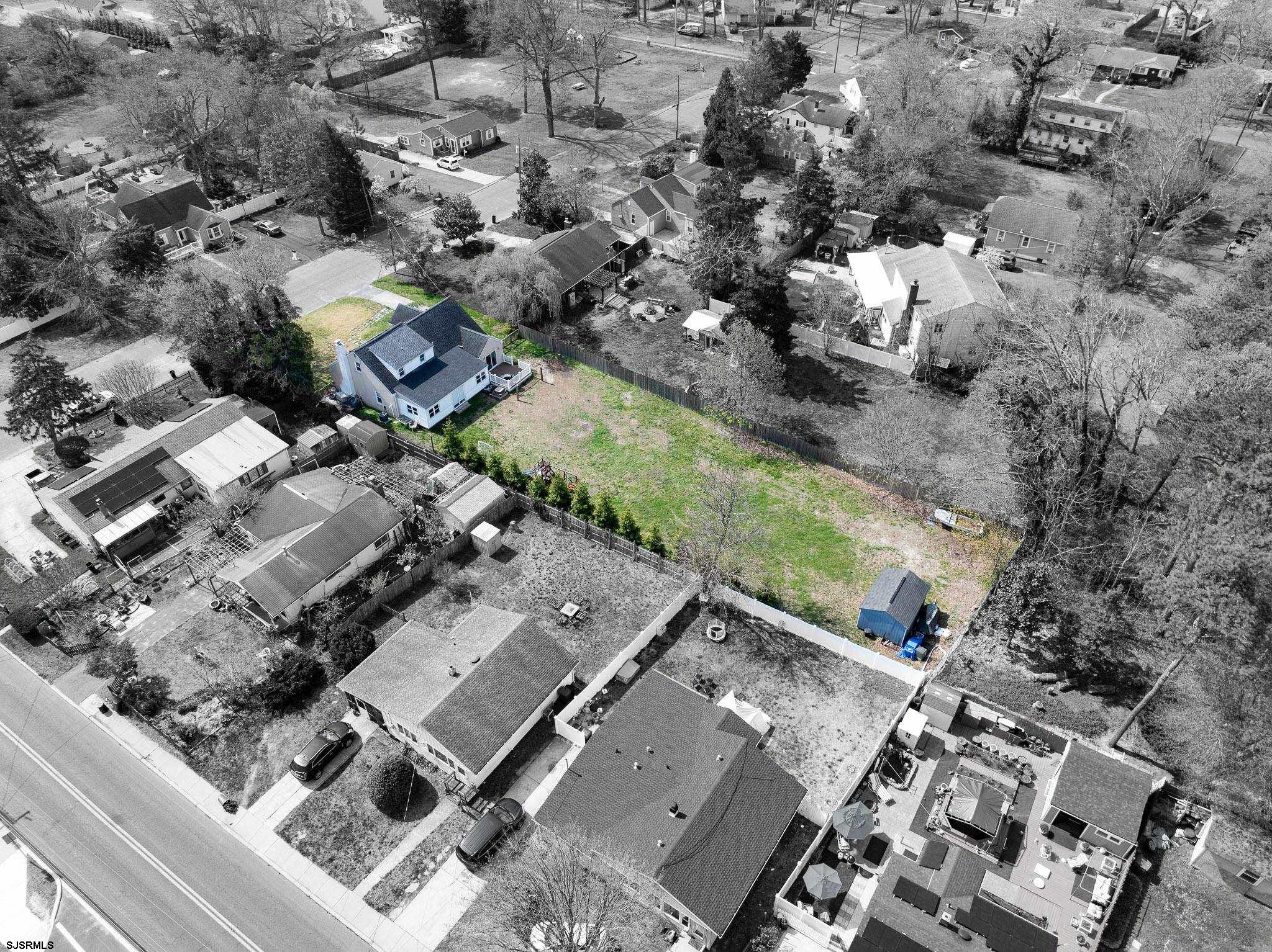 395 1st Street Northfield, NJ 08225 - Photo 40 of 54 an aerial view of multiple houses with yard