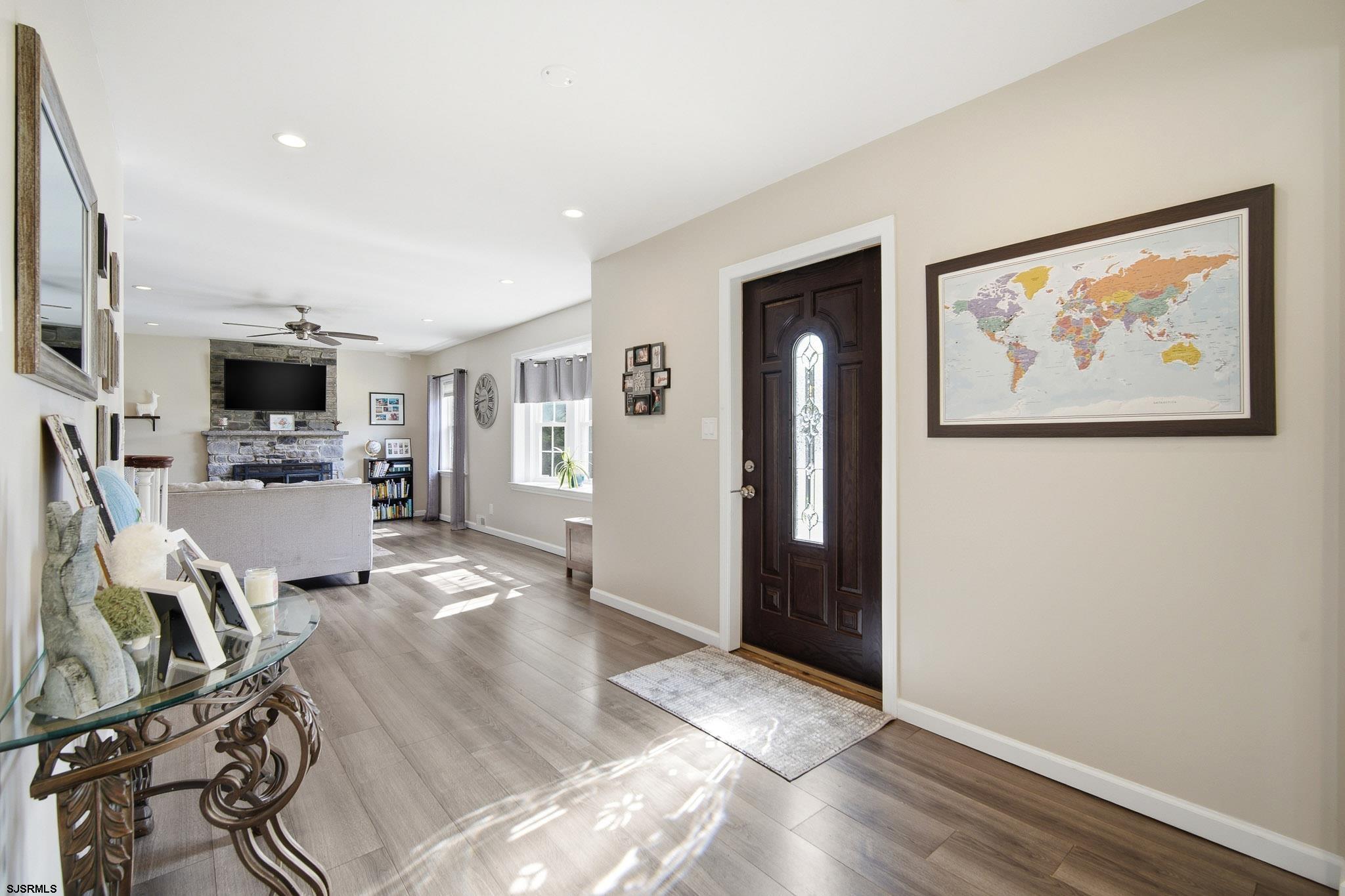 395 1st Street Northfield, NJ 08225 - Photo 4 of 54 a view of a living room with furniture and wooden floor