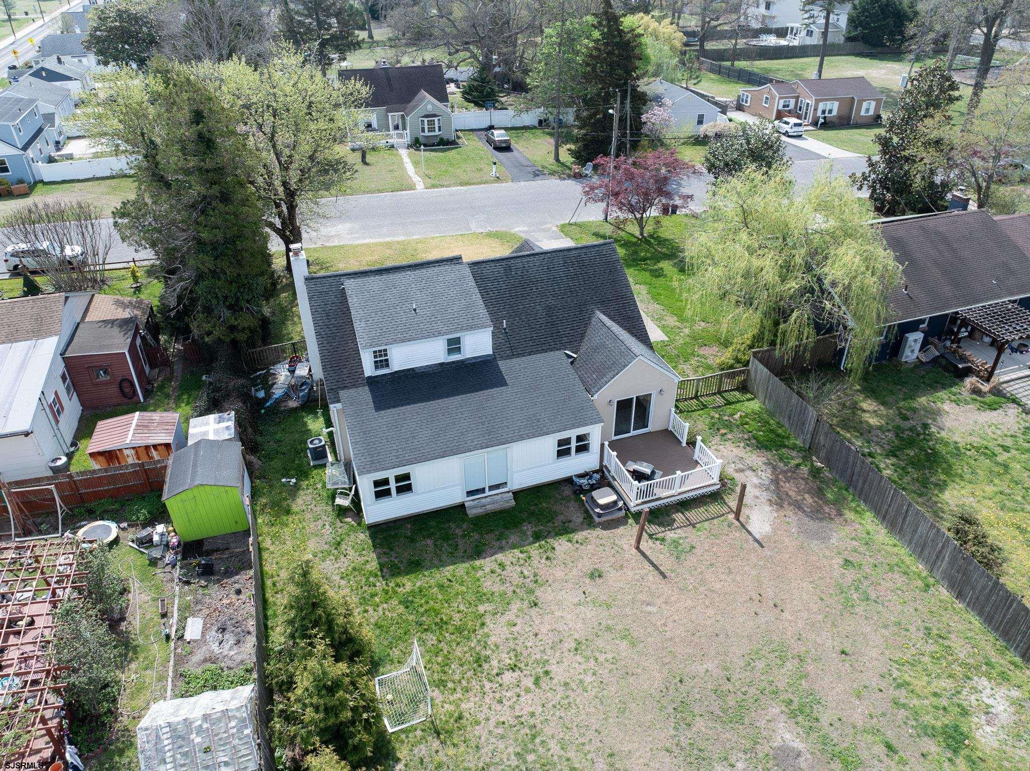 395 1st Street Northfield, NJ 08225 - Photo 50 of 54 an aerial view of a house with swimming pool and outdoor space