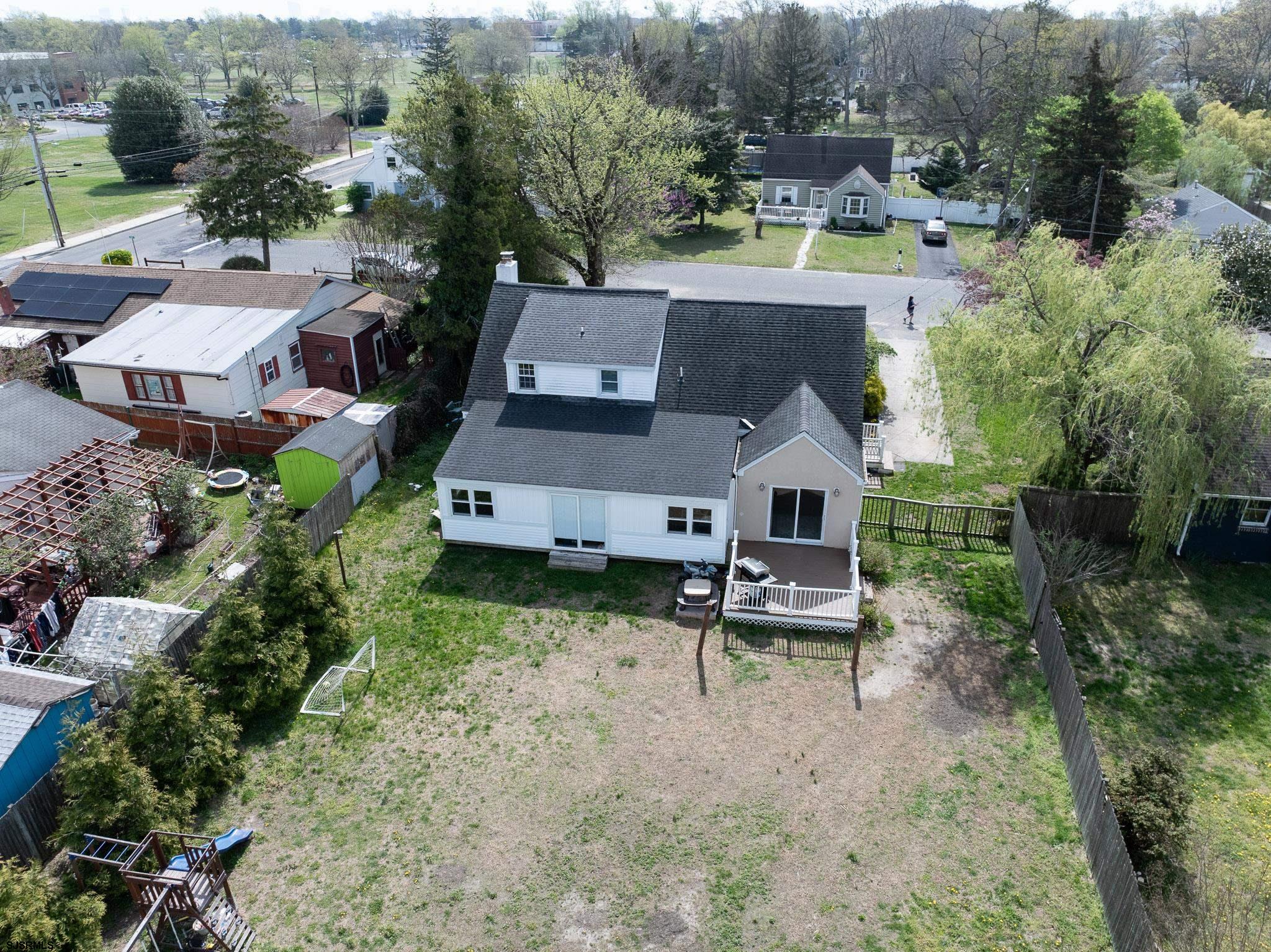 395 1st Street Northfield, NJ 08225 - Photo 51 of 54 an aerial view of a house with a yard