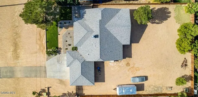an aerial view of a house with swimming pool