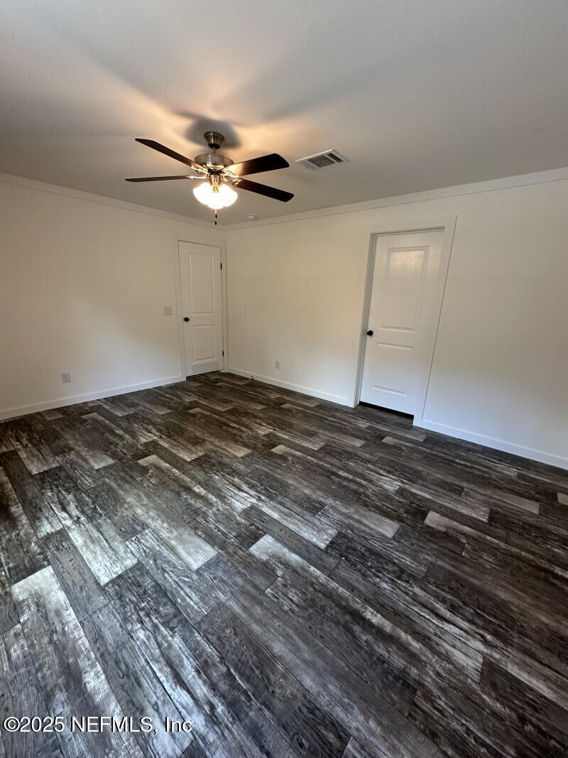 138 Nichols Road Florahome, FL 32140 - Photo 20 of 27 a view of a ceiling fan and wooden floor