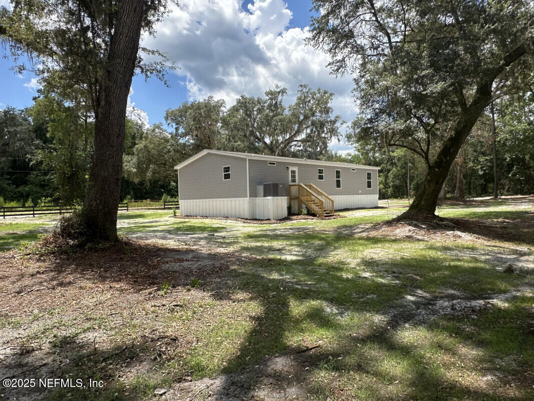 138 Nichols Road Florahome, FL 32140 - Photo 7 of 27 a view of a house with a yard