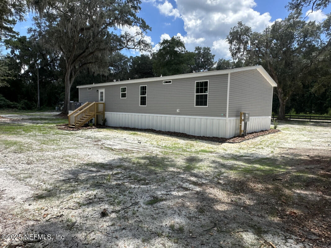 138 Nichols Road Florahome, FL 32140 - Photo 9 of 27 a view of a house with backyard