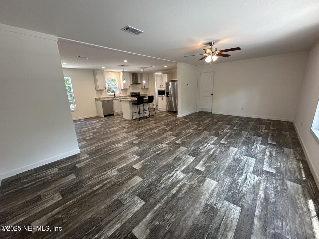 138 Nichols Road Florahome, FL 32140 - Photo 10 of 27 a view of a livingroom with furniture and chandelier fan