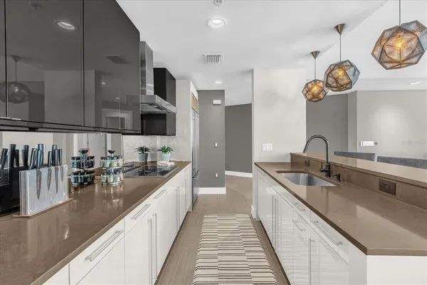 a kitchen with stainless steel appliances granite countertop a sink and cabinets