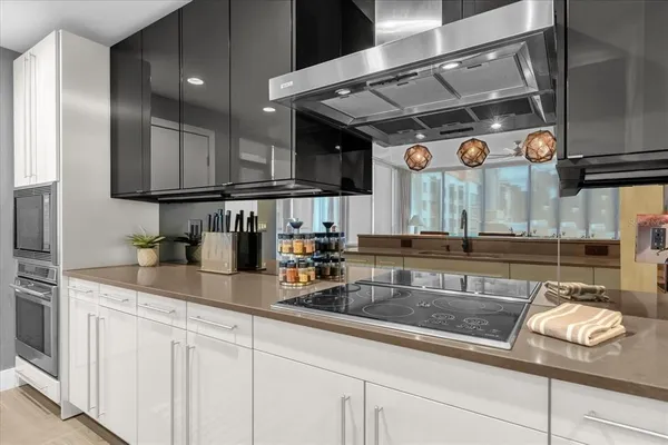 a living room with furniture and large windows