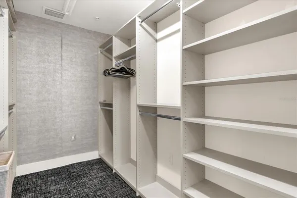 a close view of a utility room with dryer and washer
