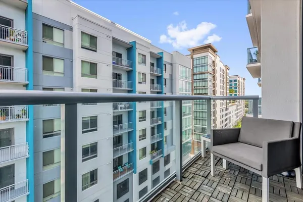 a room with lots of chairs and mirrors