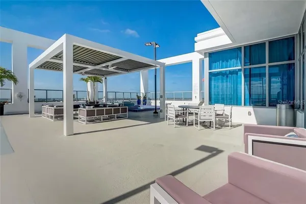 a room with lots of chairs and mirrors