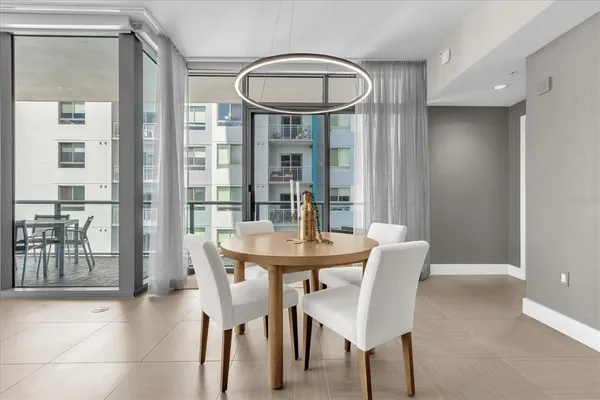 a kitchen with a dining table and chairs