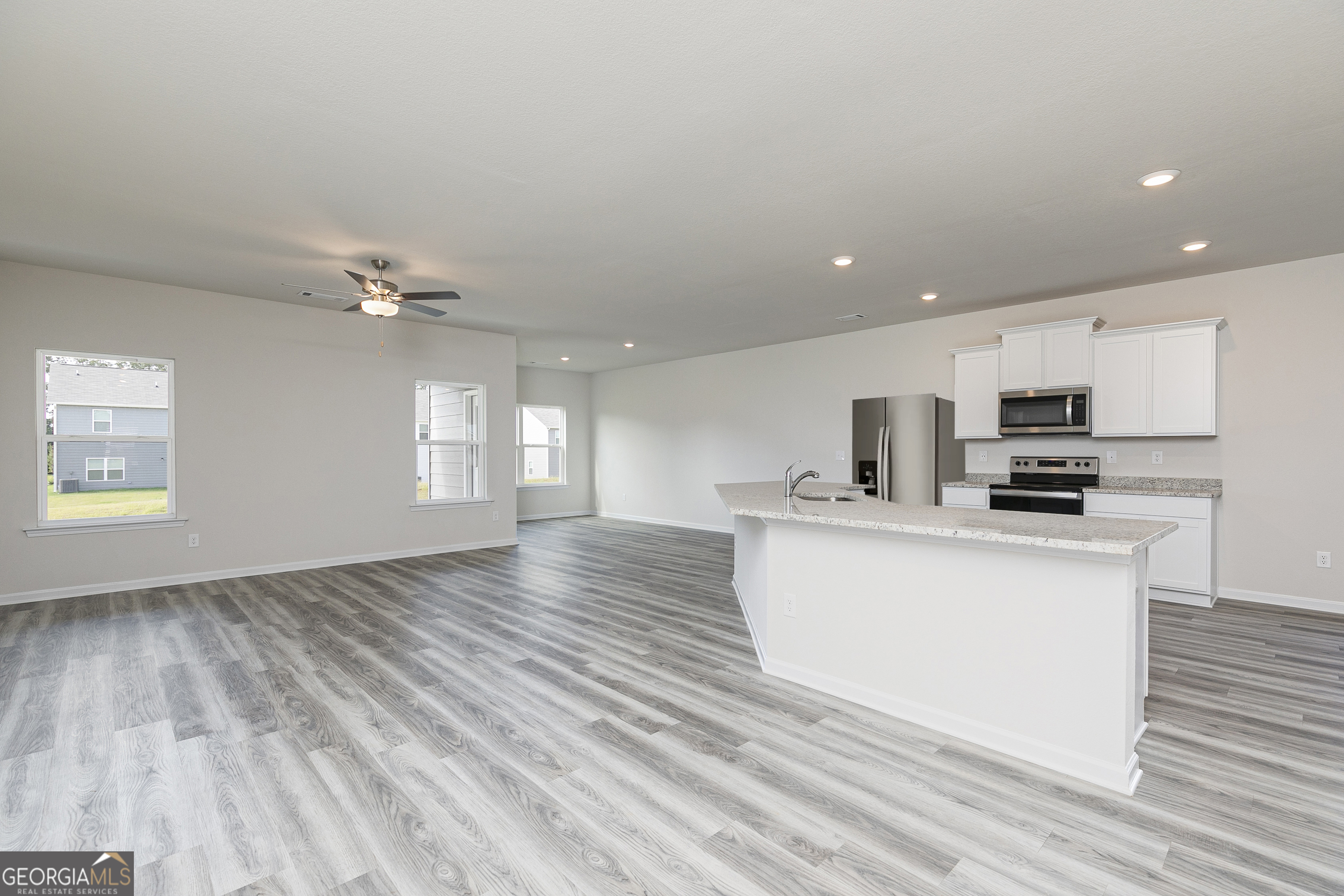 632 Slate Road Conyers, GA 30013 - Photo 7 of 26 a view of kitchen with wooden floor and electronic appliances