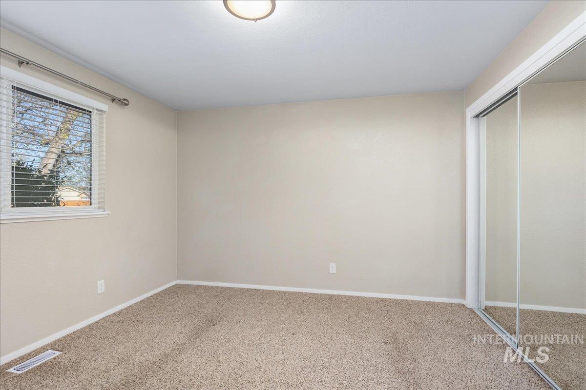 2103 North Hampton Road Boise, ID 83704 - Photo 17 of 40 Unfurnished bedroom featuring a closet and carpet floors