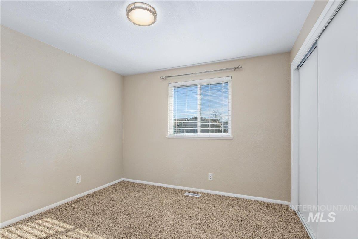 2103 North Hampton Road Boise, ID 83704 - Photo 20 of 40 Unfurnished bedroom with a closet and light carpet