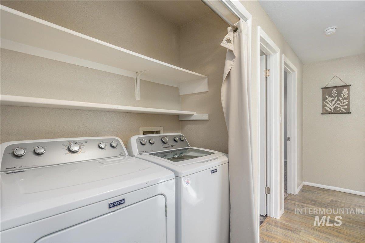 2103 North Hampton Road Boise, ID 83704 - Photo 22 of 40 Laundry area with light wood-type flooring and independent washer and dryer