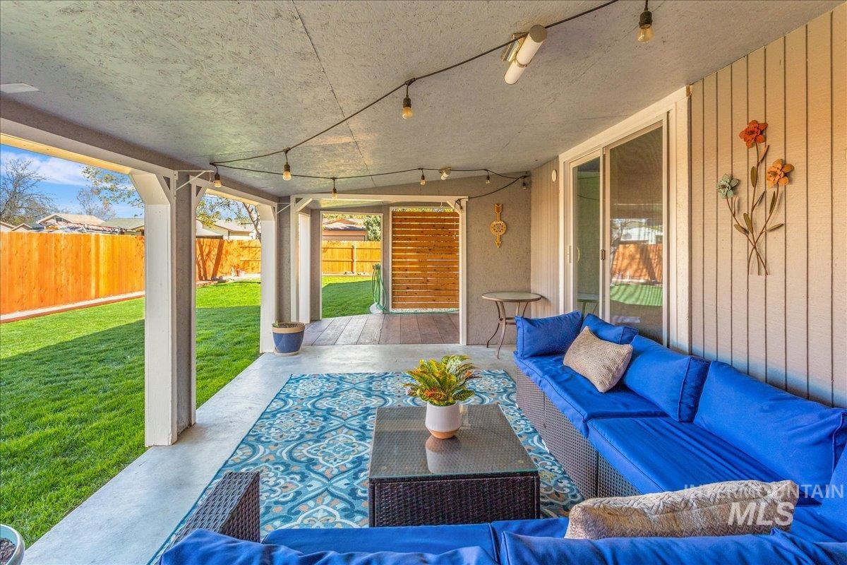 2103 North Hampton Road Boise, ID 83704 - Photo 23 of 40 Fenced backyard with a patio and an outdoor lounge area