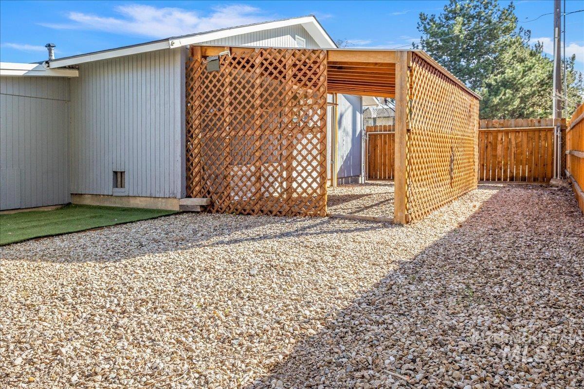 2103 North Hampton Road Boise, ID 83704 - Photo 33 of 40 View of covered carport with a fenced backyard