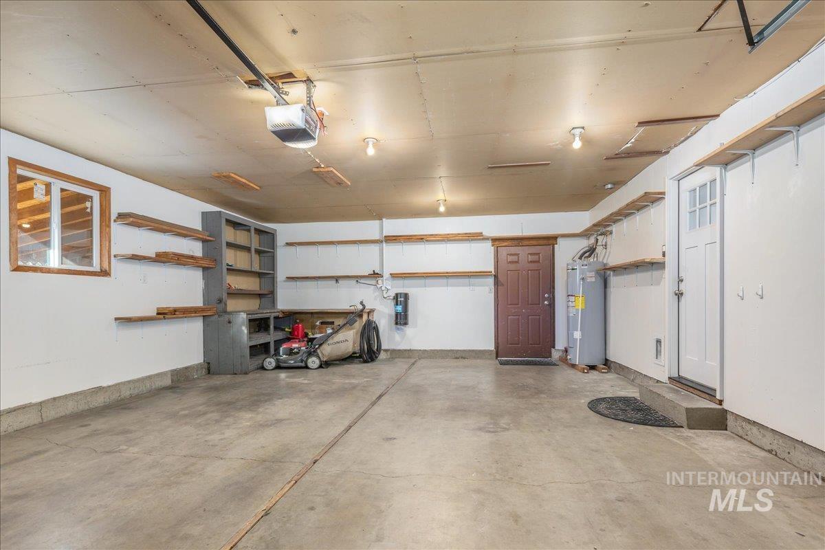 2103 North Hampton Road Boise, ID 83704 - Photo 37 of 40 Garage with electric water heater and a garage door opener