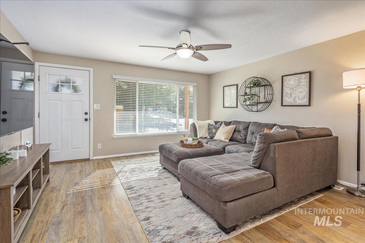 2103 North Hampton Road Boise, ID 83704 - Photo 4 of 40 Living room with a ceiling fan and light wood finished floors