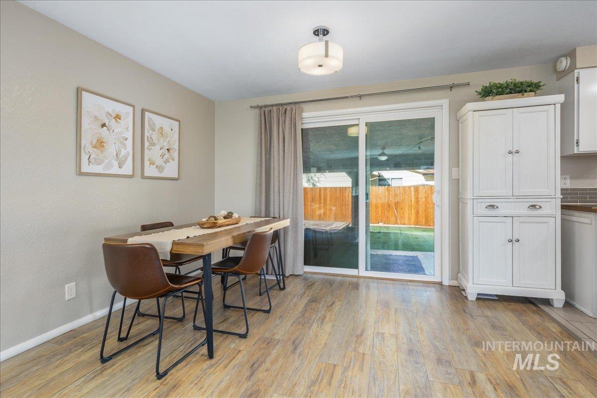 2103 North Hampton Road Boise, ID 83704 - Photo 9 of 40 Dining space featuring light wood finished floors and a textured wall