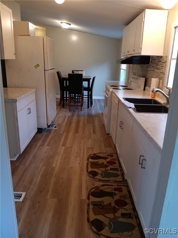 125 Lone Pine Road Crewe, VA 23930 - Photo 13 of 25 Kitchen with white cabinets, backsplash, wood-type