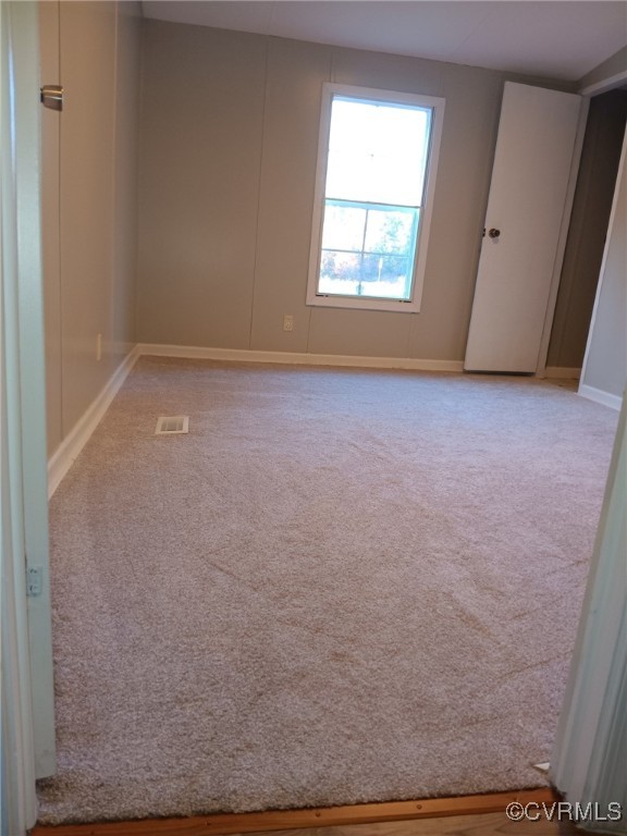125 Lone Pine Road Crewe, VA 23930 - Photo 16 of 25 Unfurnished room with light colored carpet