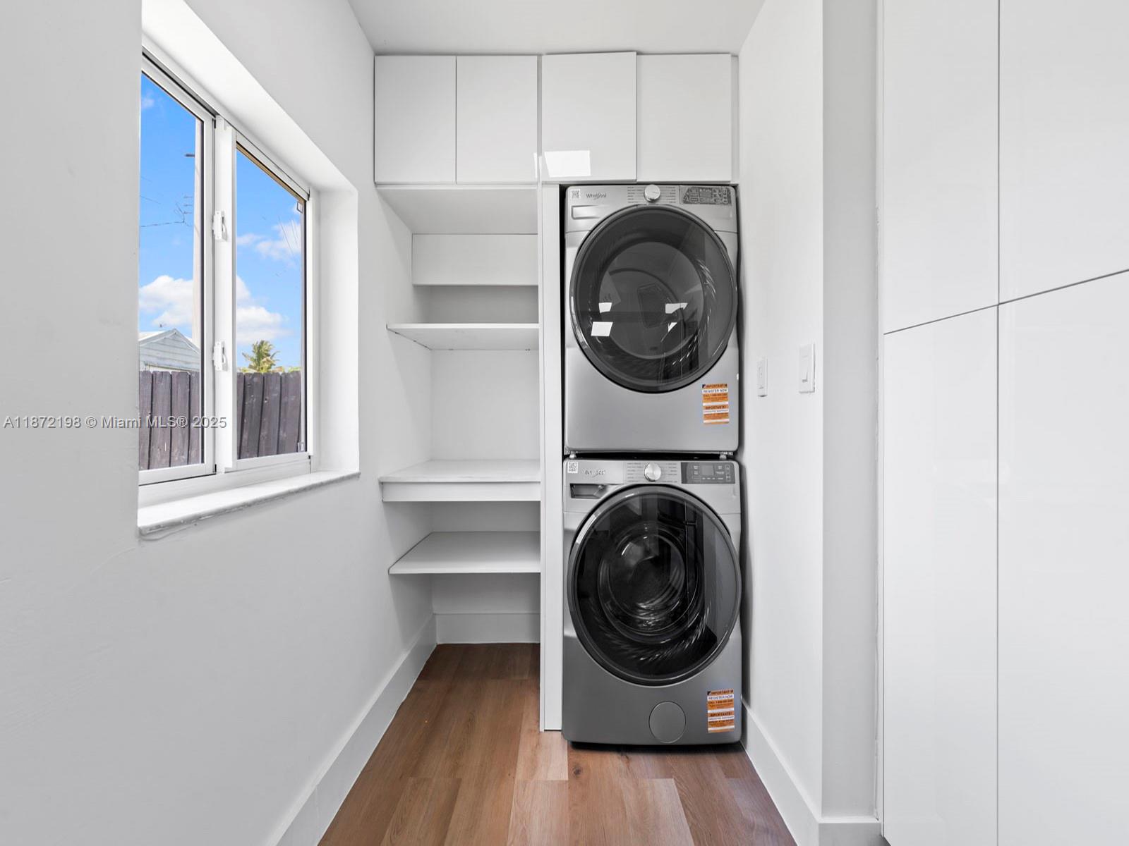 10530 Southwest 146th Street Miami, FL 33176 - Photo 15 of 54 a view of a hallway with washer and dryer