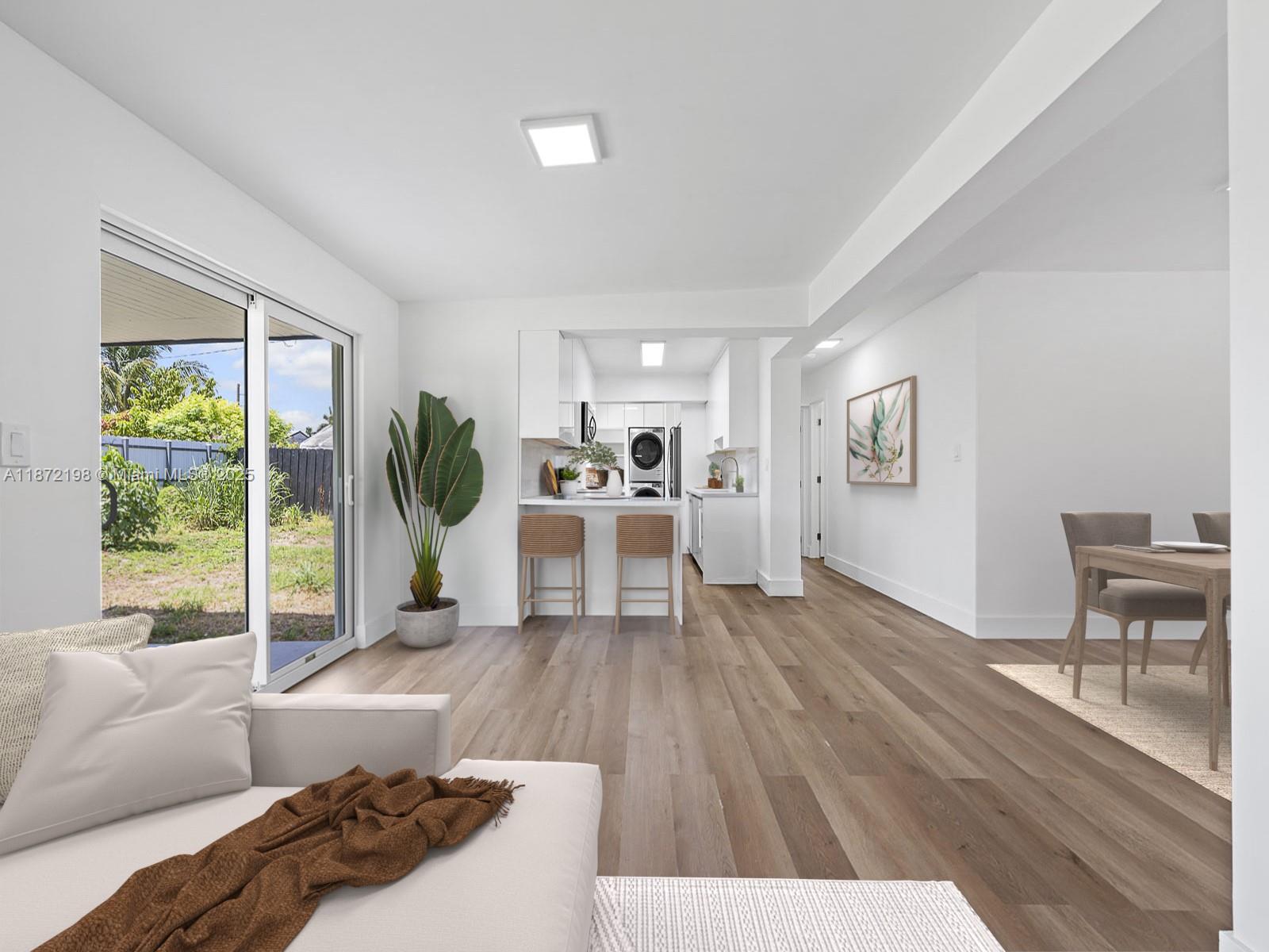 10530 Southwest 146th Street Miami, FL 33176 - Photo 18 of 54 a living room with furniture and a large window