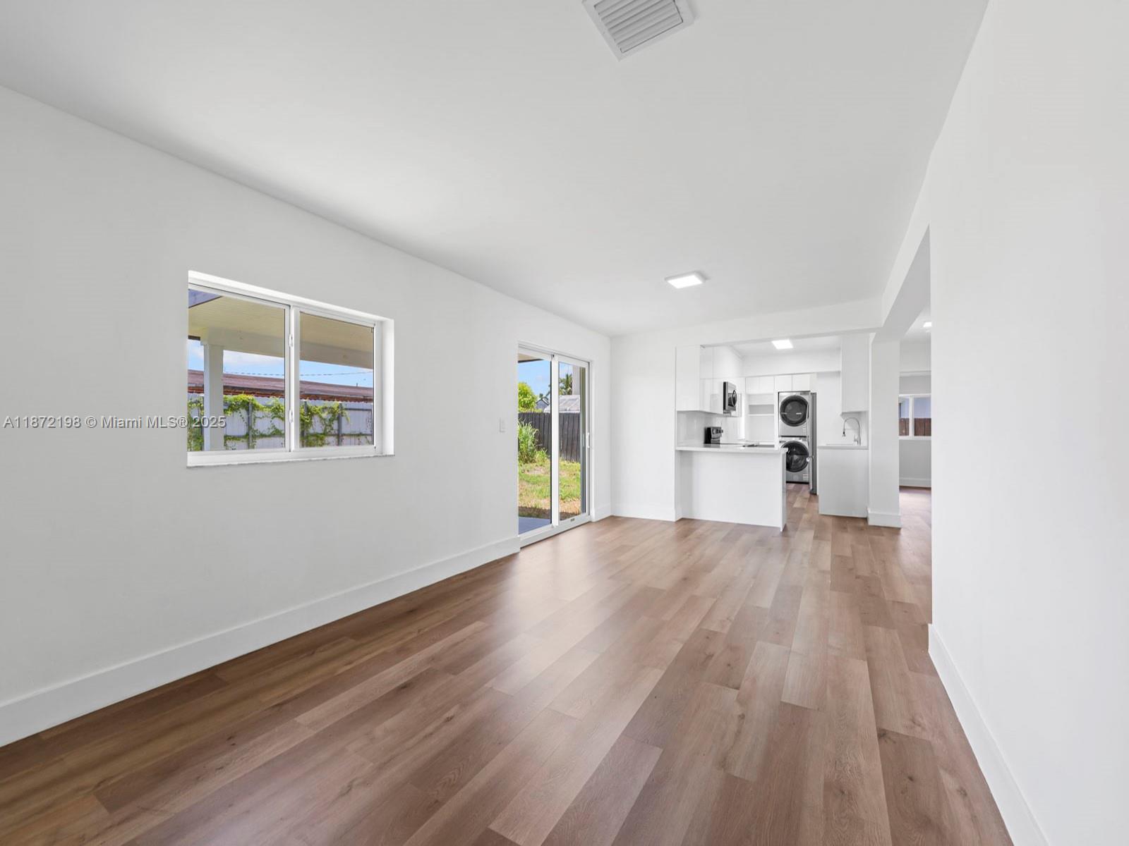 10530 Southwest 146th Street Miami, FL 33176 - Photo 20 of 54 wooden floor in an empty room with a window
