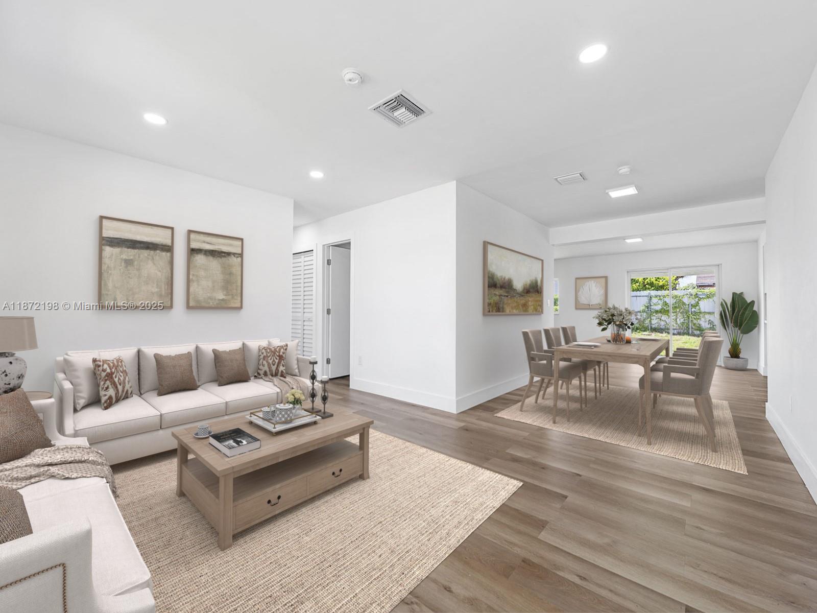 10530 Southwest 146th Street Miami, FL 33176 - Photo 2 of 54 a living room with furniture and wooden floor