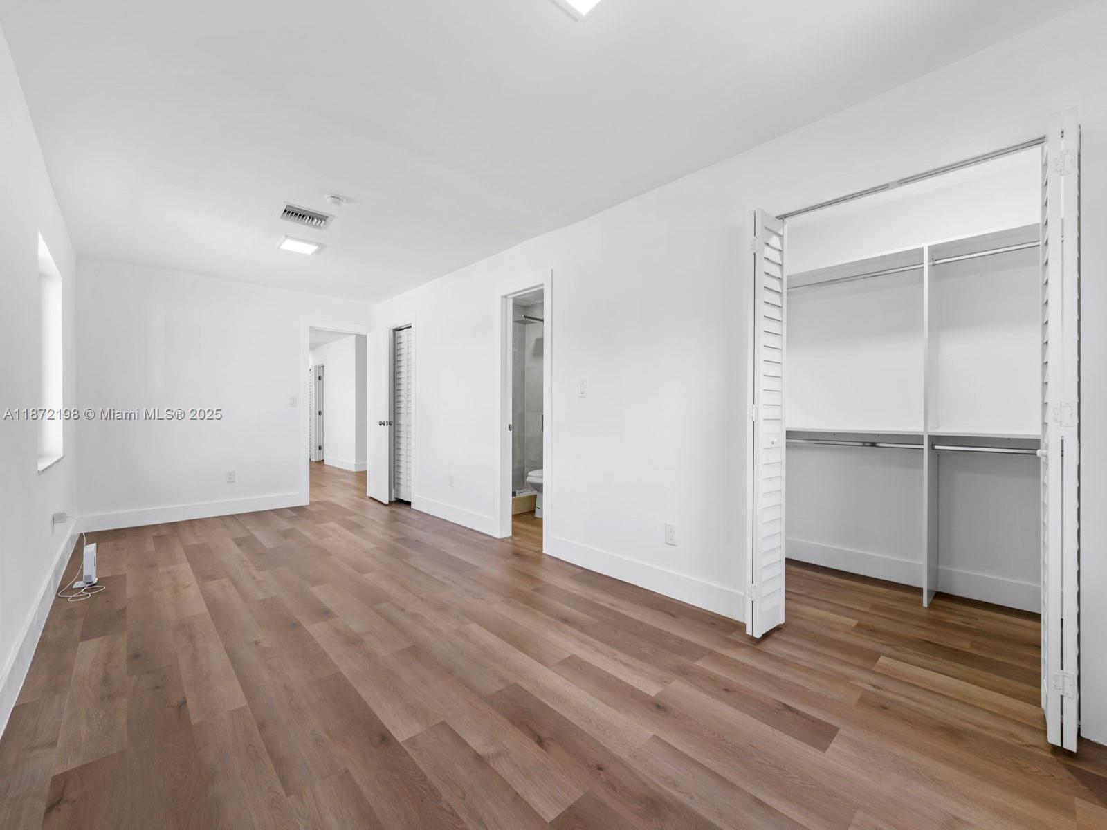 10530 Southwest 146th Street Miami, FL 33176 - Photo 25 of 54 a view of empty room with wooden floor