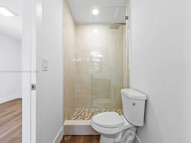 an aerial view of a house with swimming pool