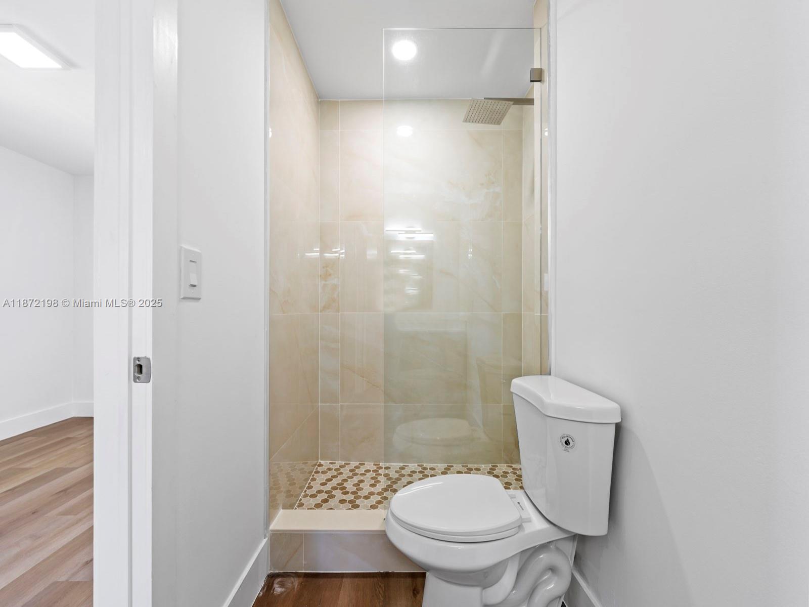 10530 Southwest 146th Street Miami, FL 33176 - Photo 29 of 54 a bathroom with a toilet and a shower