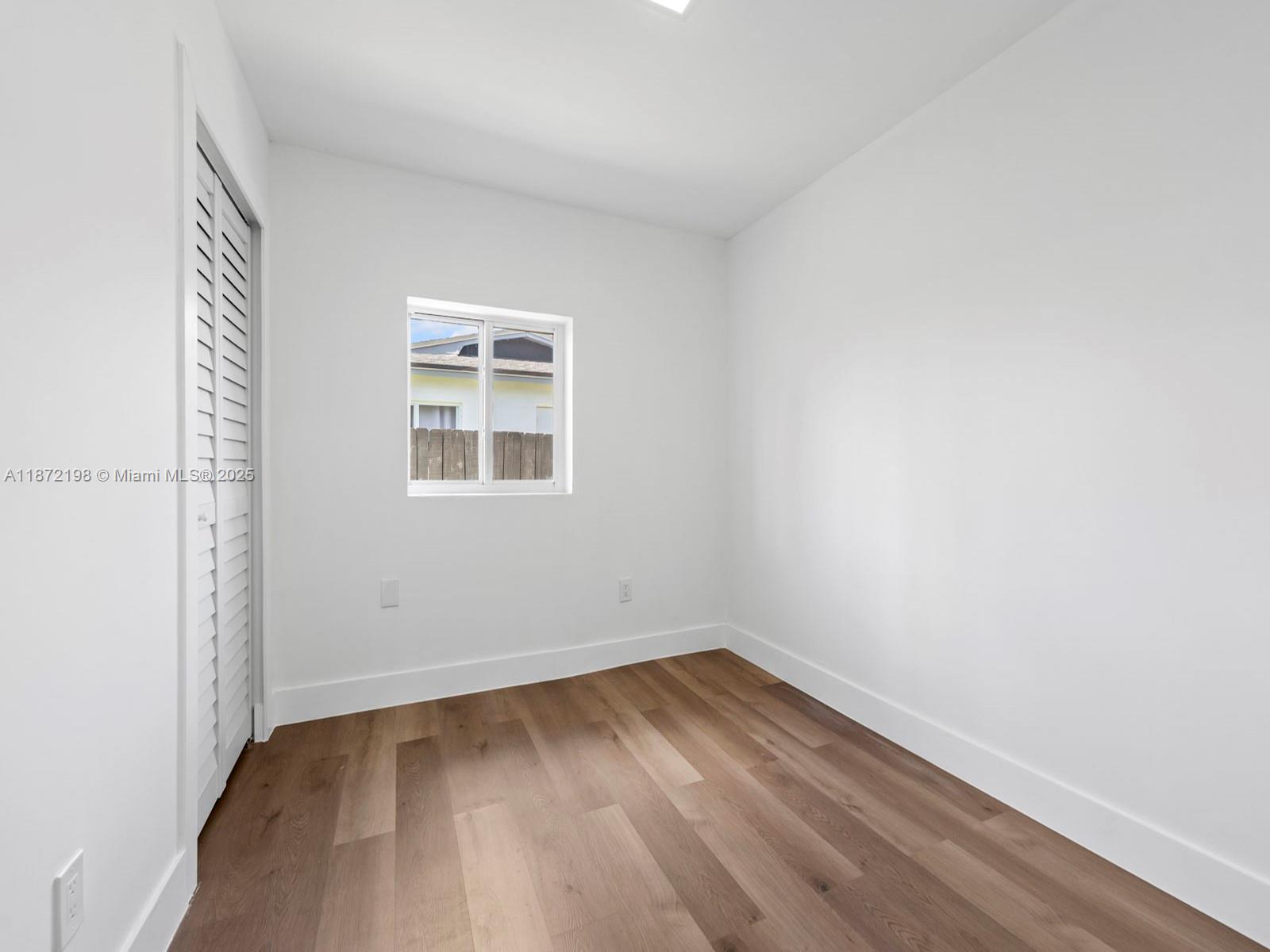 10530 Southwest 146th Street Miami, FL 33176 - Photo 36 of 54 an empty room with a window