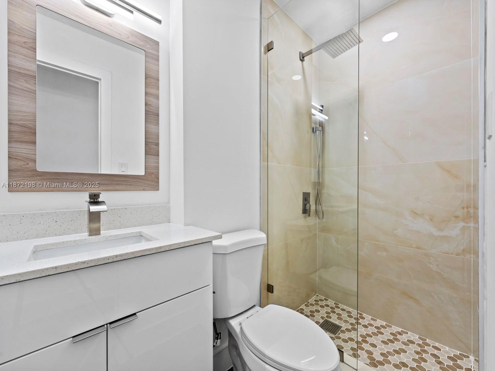 10530 Southwest 146th Street Miami, FL 33176 - Photo 38 of 54 a bathroom with a sink a toilet and shower