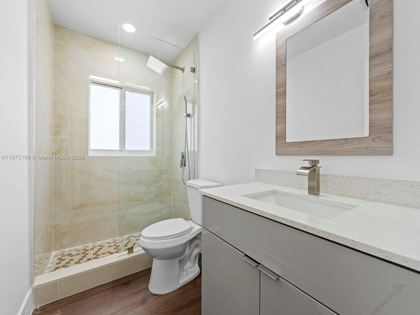 10530 Southwest 146th Street Miami, FL 33176 - Photo 41 of 54 a bathroom with a sink a toilet and a shower