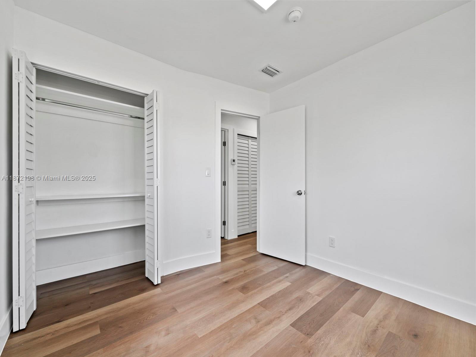 10530 Southwest 146th Street Miami, FL 33176 - Photo 43 of 54 a view of an empty room with a closet