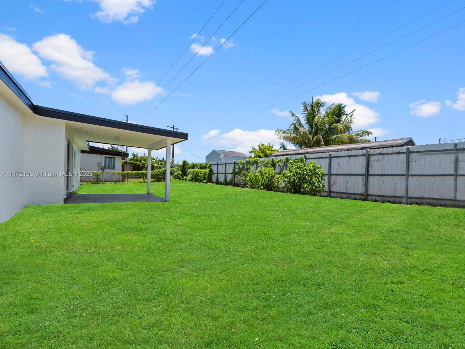 10530 Southwest 146th Street Miami, FL 33176 - Photo 47 of 54 a view of a backyard with a garden