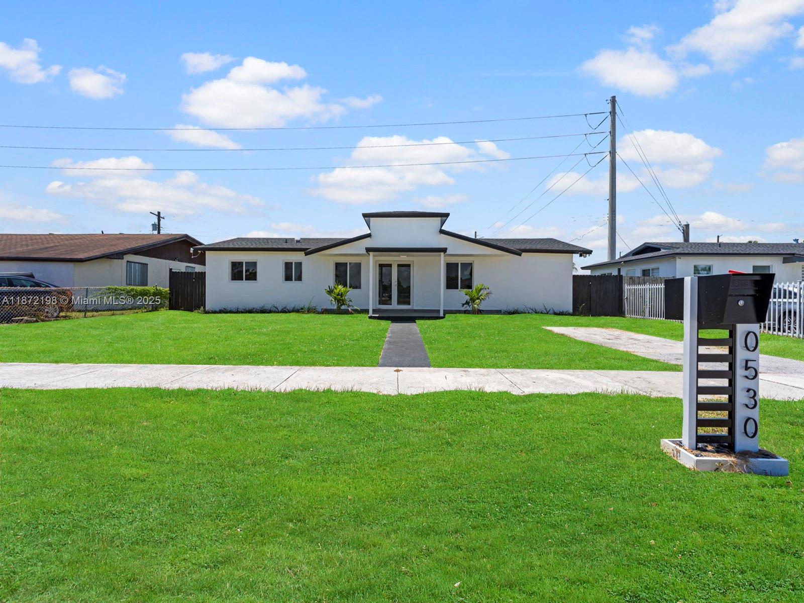 10530 Southwest 146th Street Miami, FL 33176 - Photo 52 of 54 a view of a house with a big yard