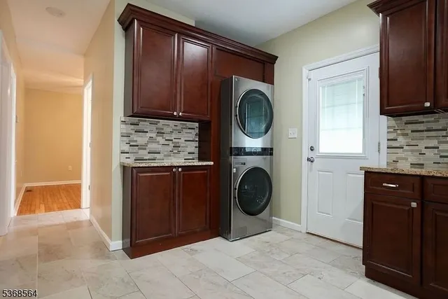 a view of a kitchen with washer and dryer