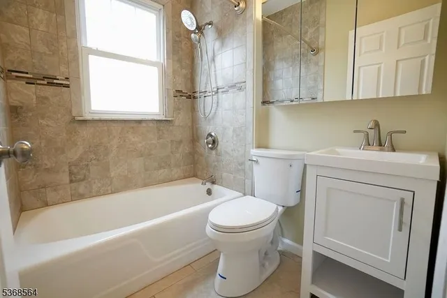 a bathroom with a sink toilet and bathtub