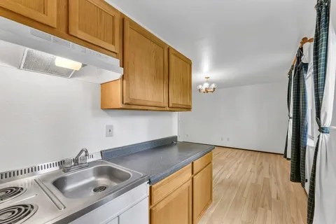 a kitchen with a sink and cabinets