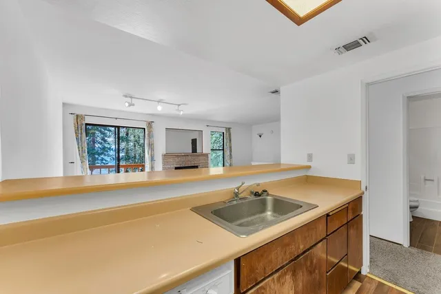 a kitchen that has a sink and a stove