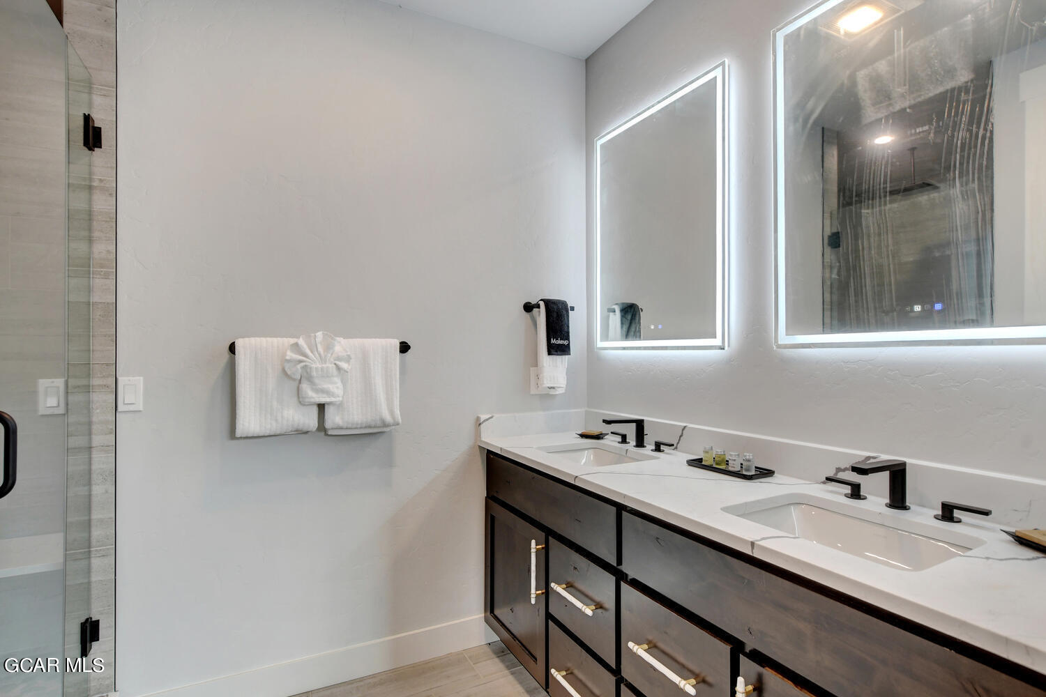 Undisclosed Address Winter Park, CO 80482 - Photo 19 of 52 a bathroom with a sink vanity and mirror
